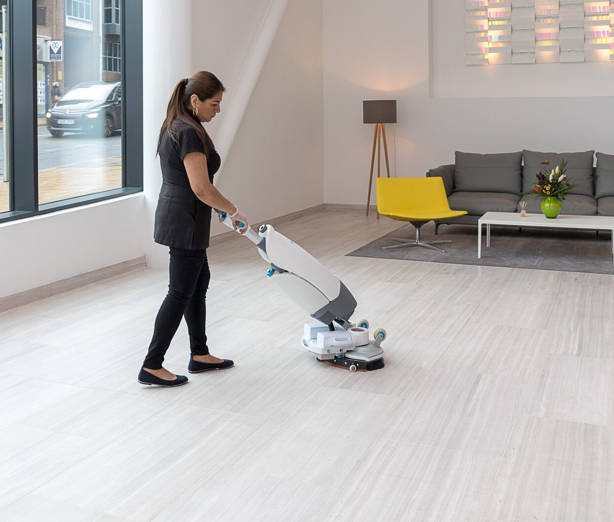 cleaner using iMop to clean reception floor